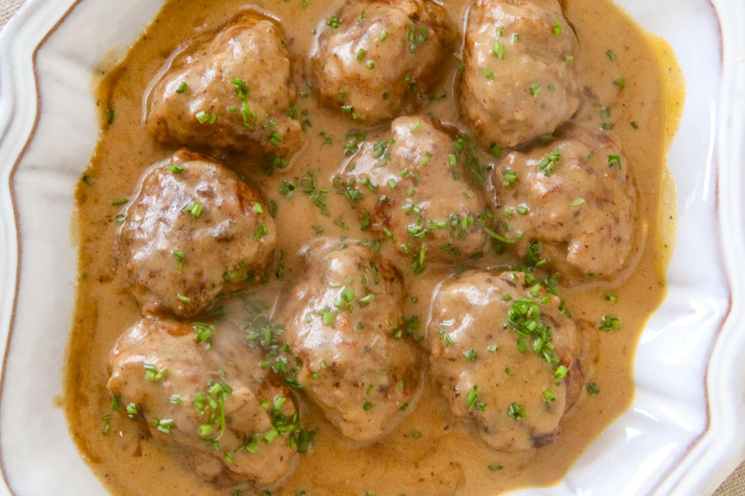 A dish of Swedish meatballs in gravy.
