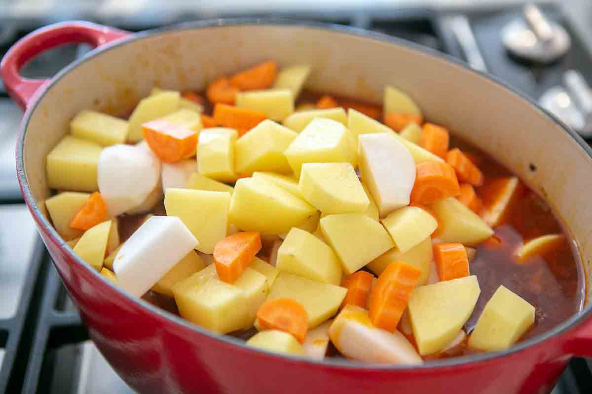 add root vegetables to short rib stew