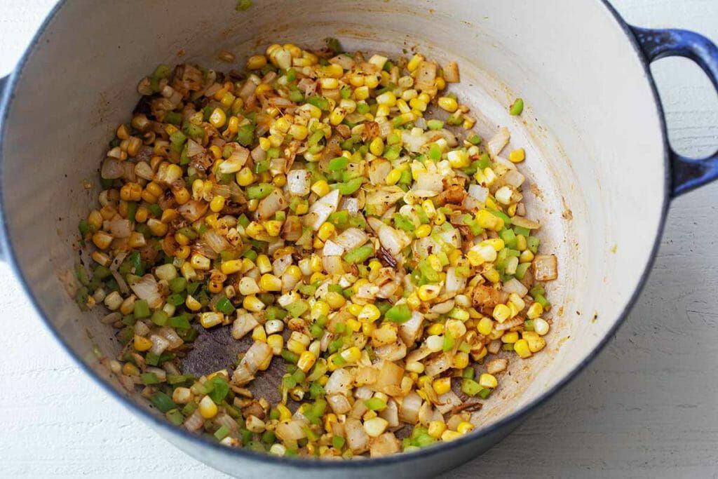 Saute the corn pepper and onions for easy green chili soup