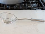 Spider strainer on a counter 