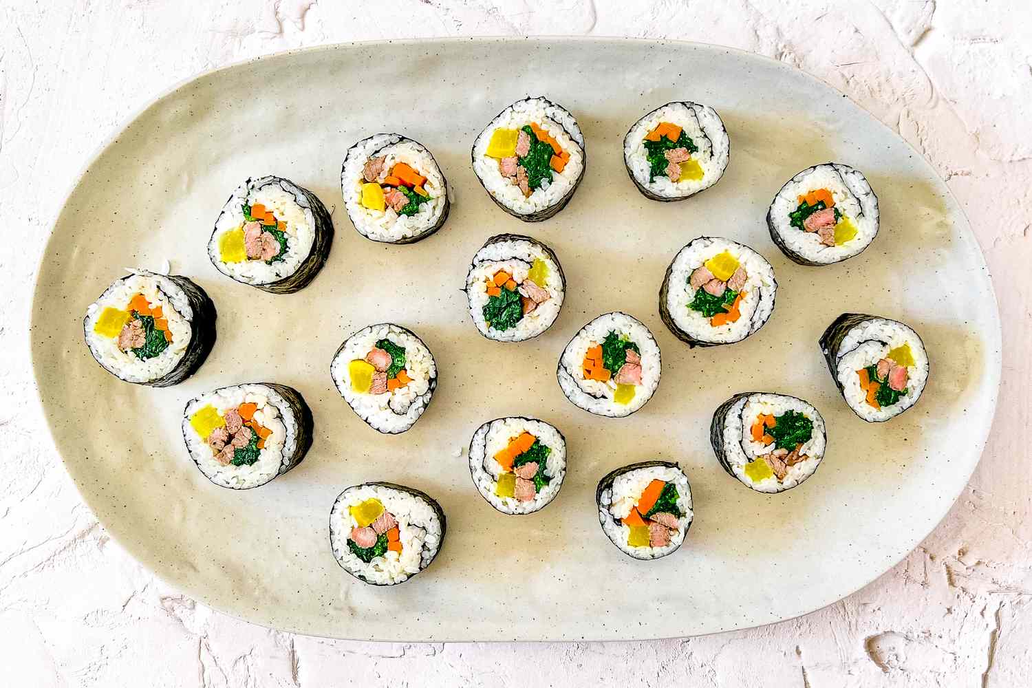Classic Kimbap (Korean Seaweed Rice Roll) on a Plate