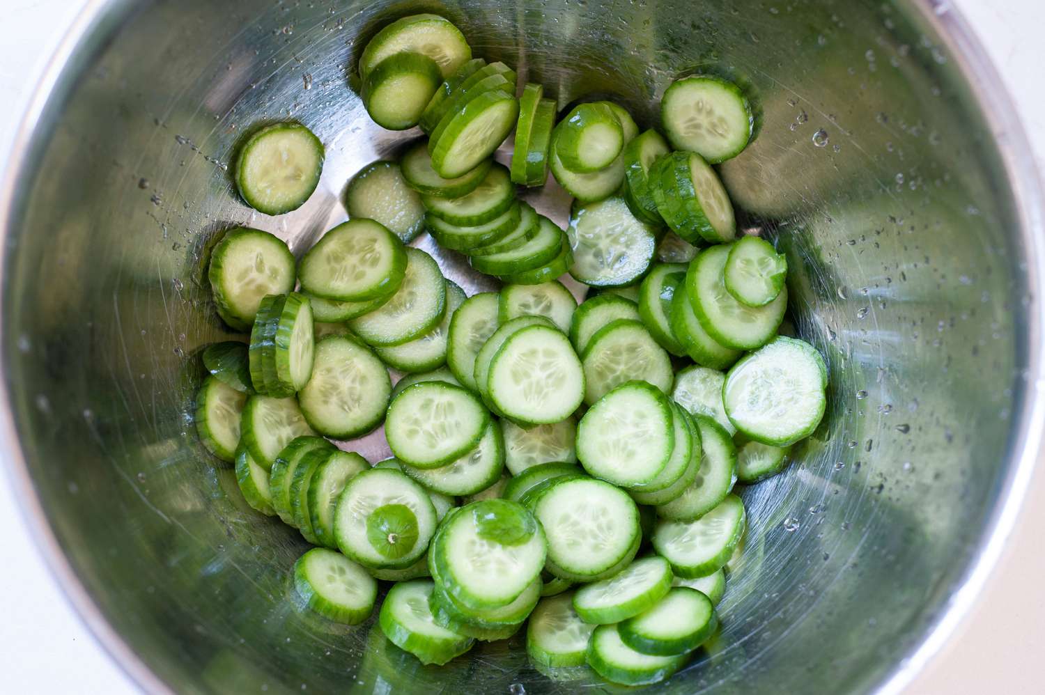Salted and drained cucumbers in a bowl.