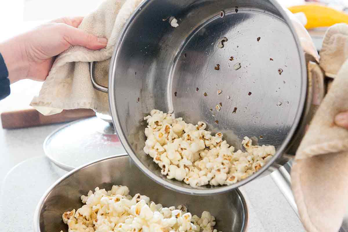 Immediately empty popped popcorn into a serving bowl