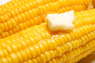 dollop of butter on a cob of corn (close-up)