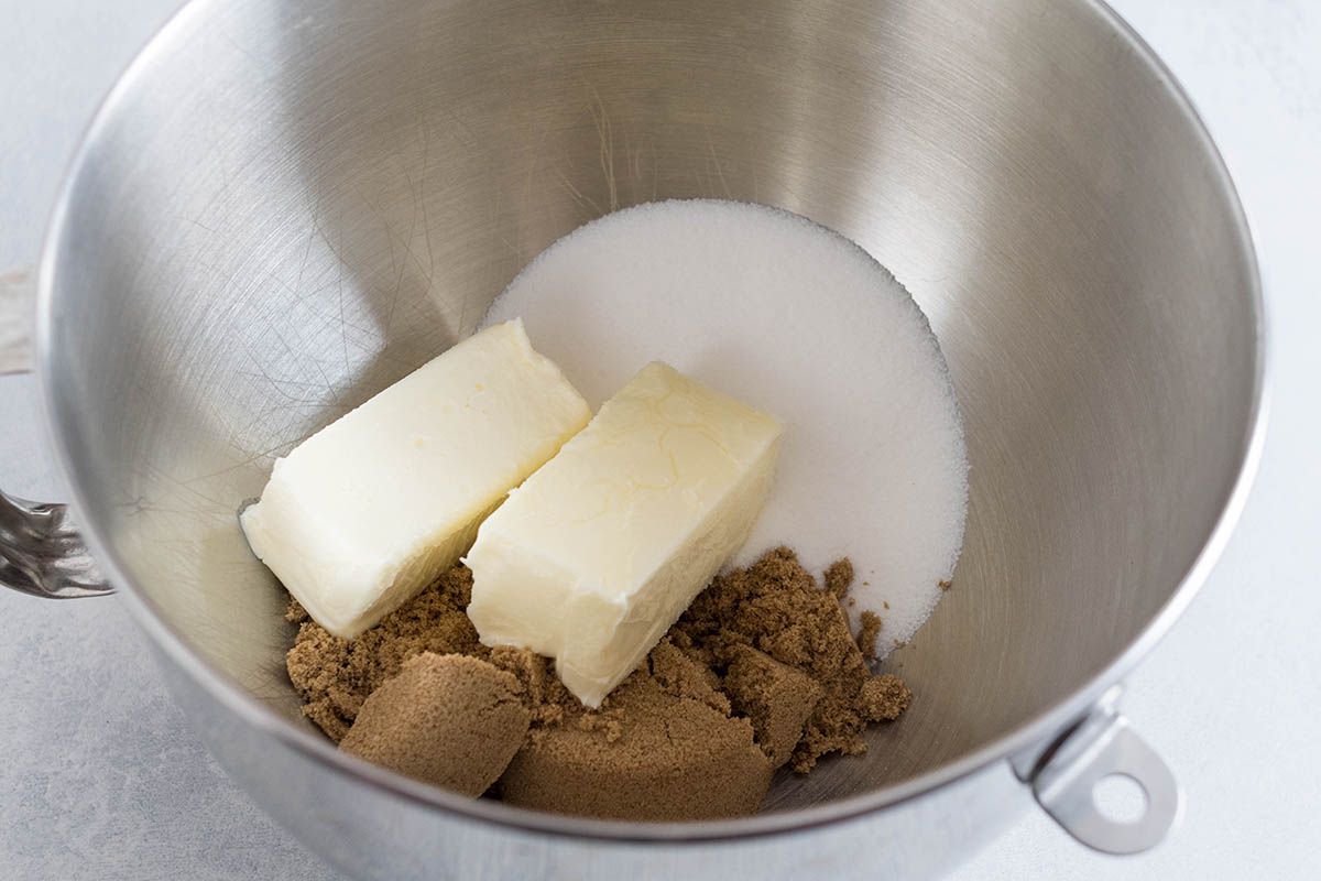 Butter, sugar and brown sugar in a metal bowl for easy chocolate chip cookie recipe.