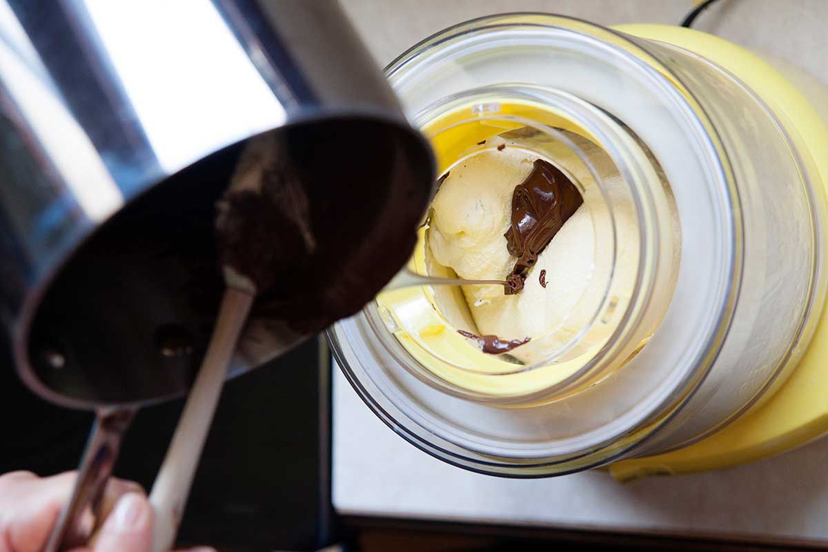 Homemade Ice Cream for an Ice Cream Maker - chocolate being poured into an ice cream maker