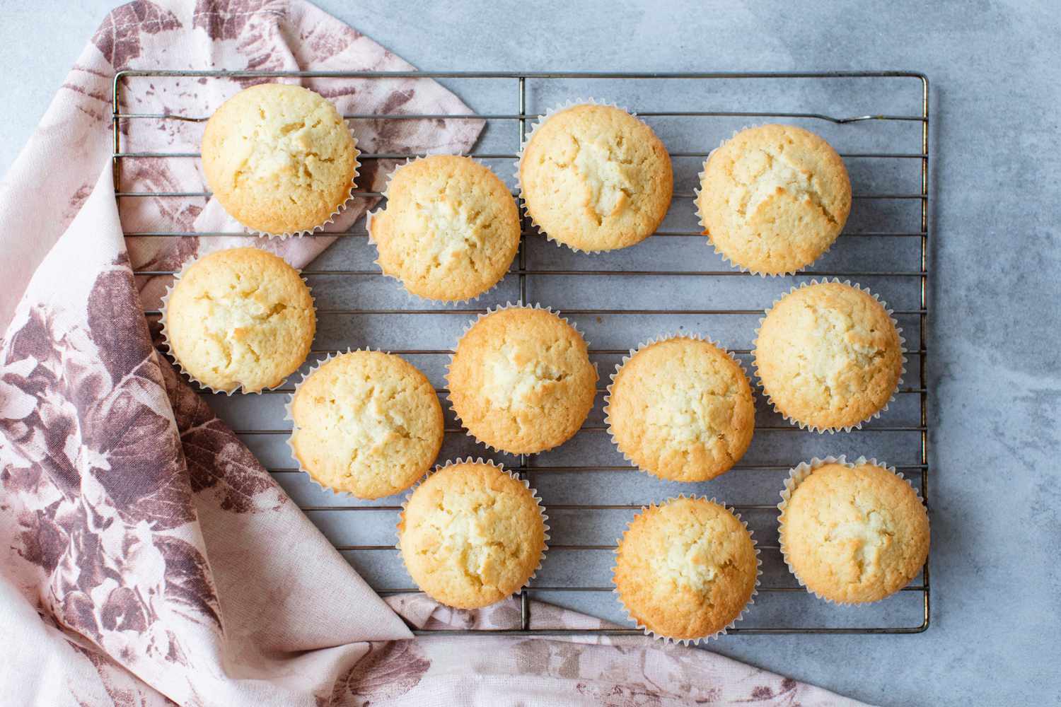 Baked Coconut Cupcakes on Cooling Rack