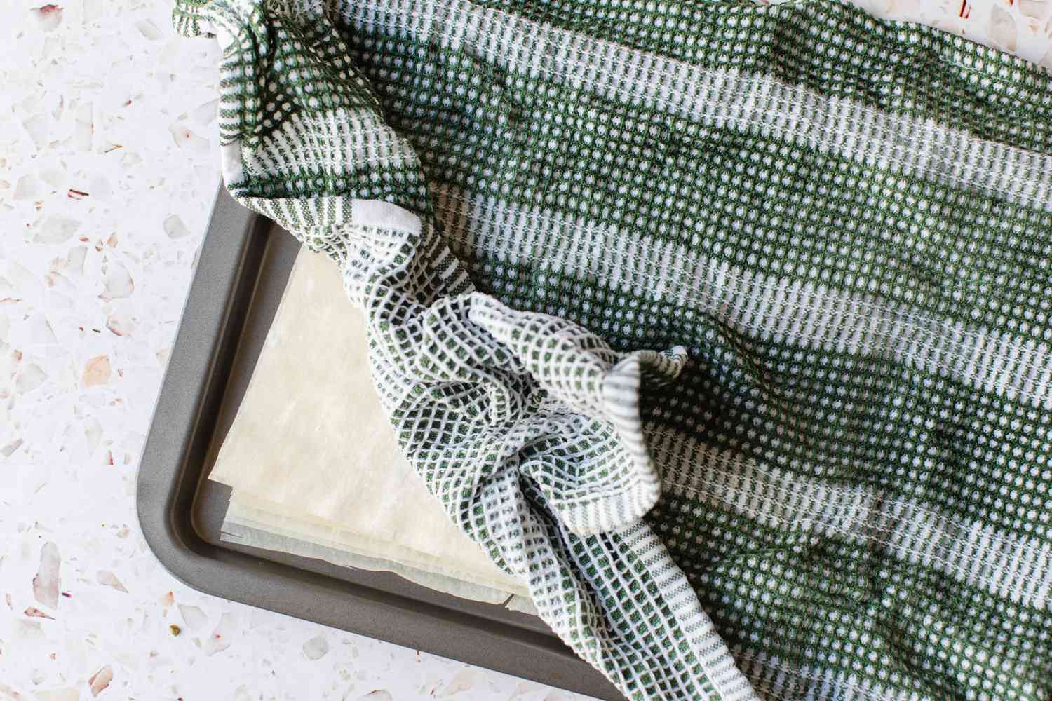 Phyllo Dough Thawed in a Baking Pan Covered with a Wet Kitchen Towel