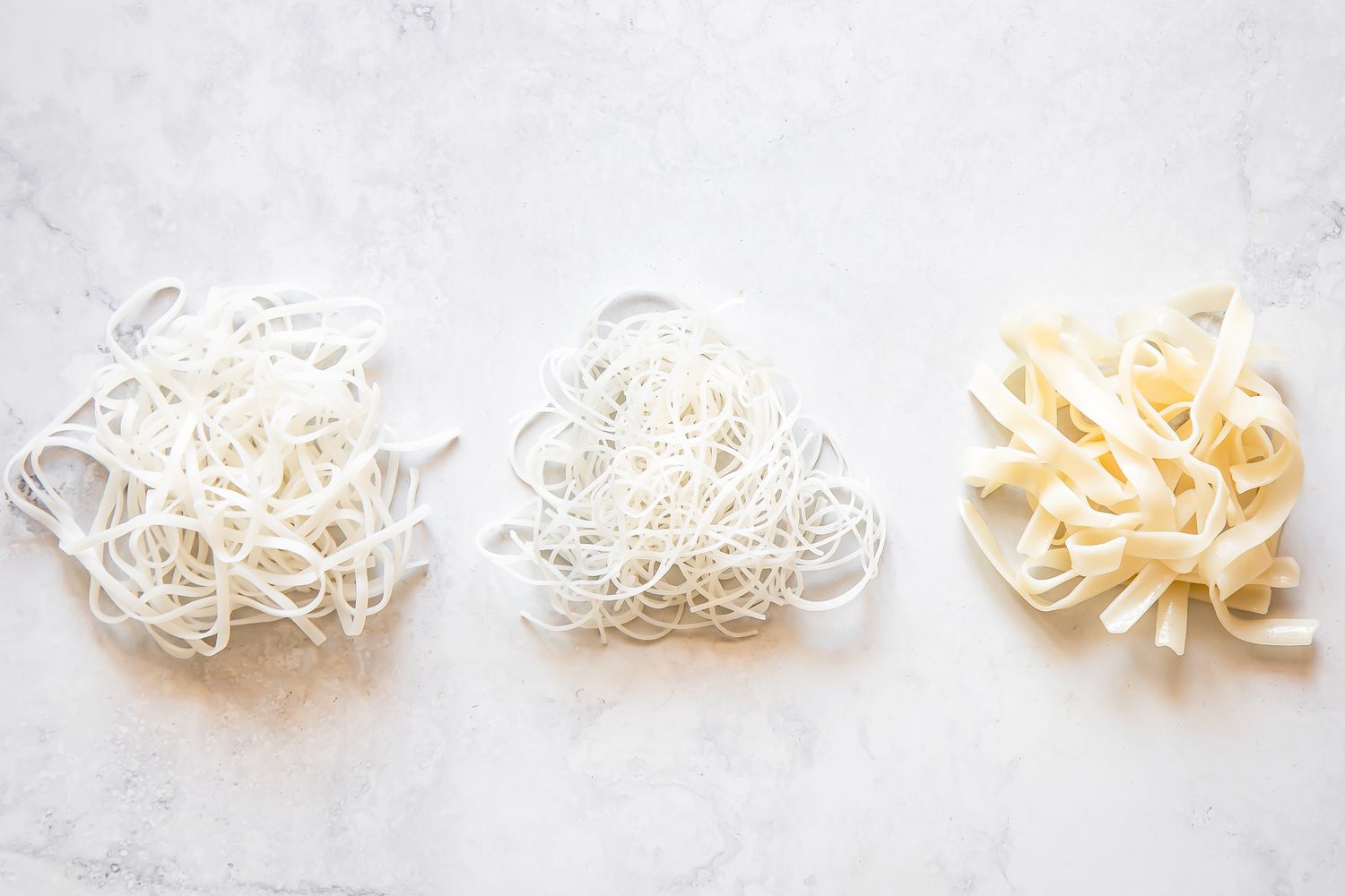 Different Types of Rice Noodles Wrapped Into Little Bundles on the Counter