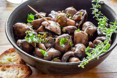 Marinated Mushrooms in a Bowl with Herbs