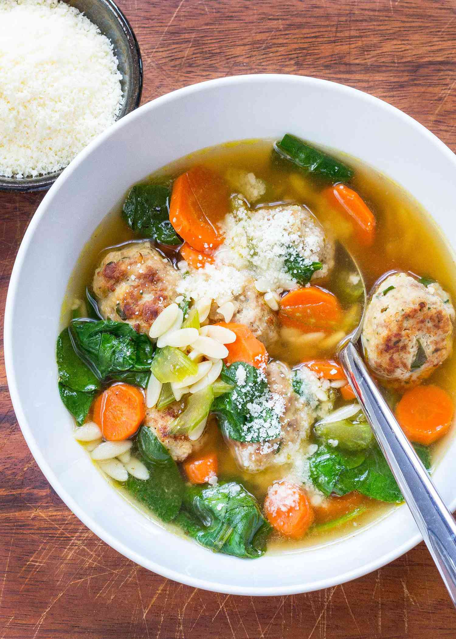 Turkey Meatball Soup in a white bowl with a spoon