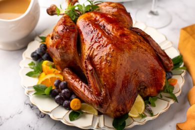 Whole roasted turkey on a serving plate