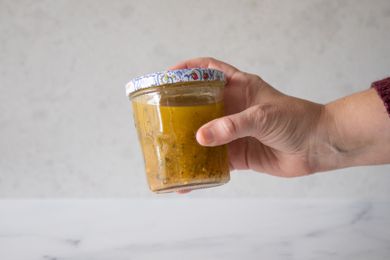 Vigorously shake jar of Italian dressing.