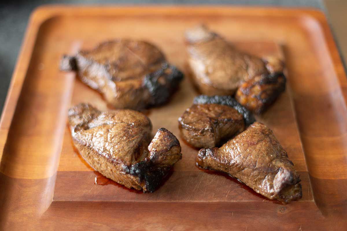 Easy broiled steak on a cutting board.
