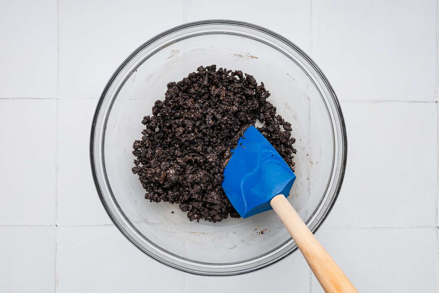 Making the Crunchies: Baked Cookie Crumbs Mixed With the Chocolate Shell for Cookies & Cream Ice Cream Cake