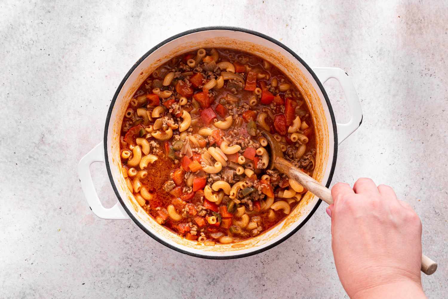 One-Pot Taco Pasta Intermittently Stirred Using a Wooden Spoon