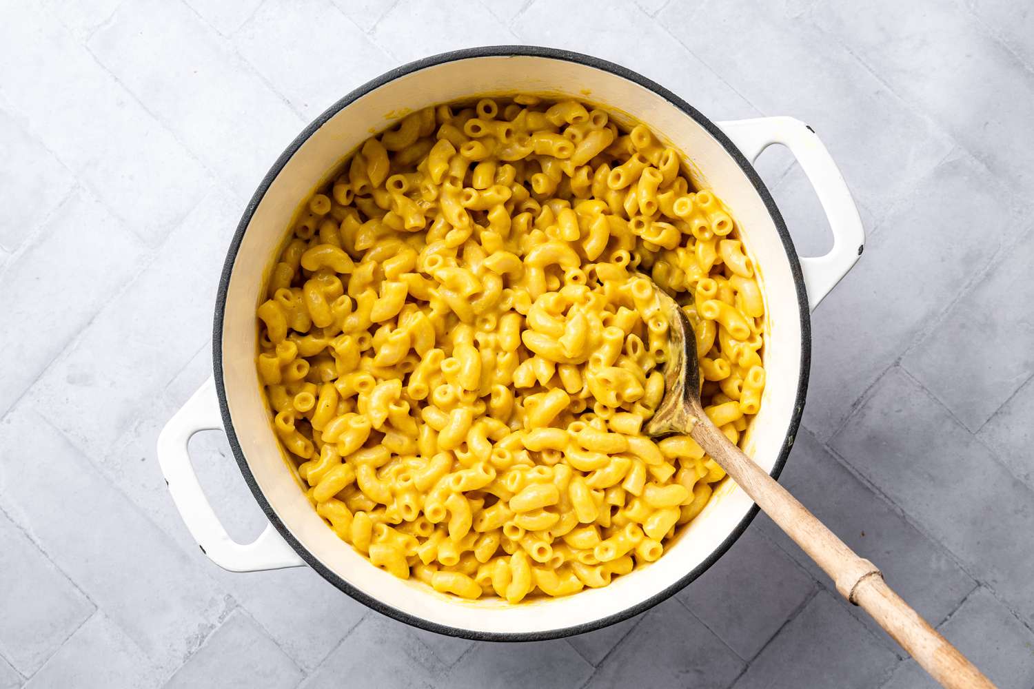 Pot of Vegan Mac and Cheese with a Wooden Spoon