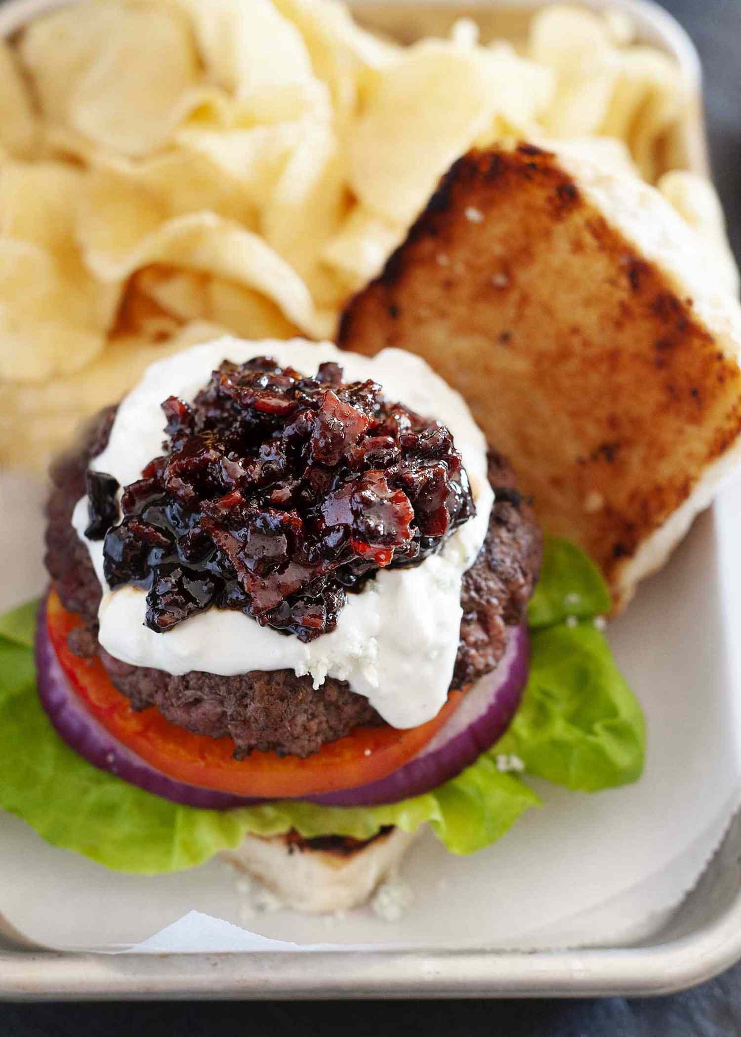 Bacon jam on top of an open-faced burger to show what is bacon jam.