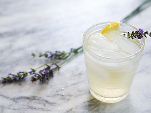 Lavender Lemonade on a small glass garnished with fresh lavender
