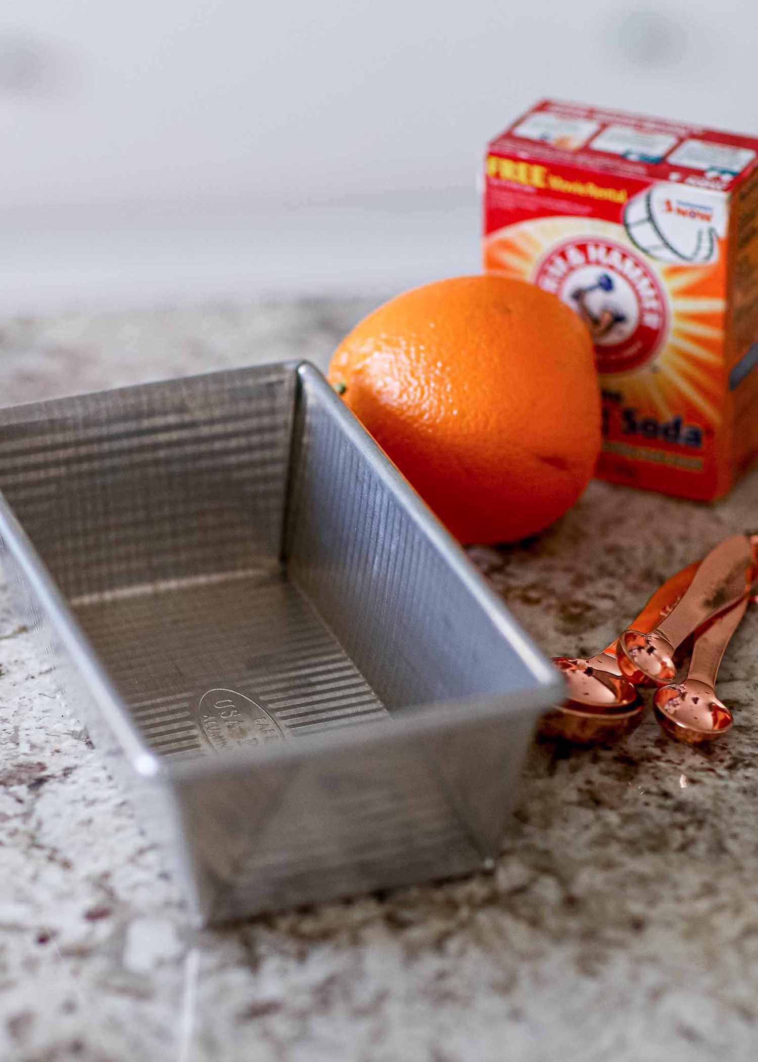 Glass Loaf Pan Guide - aluminum loaf pan with orange and baking soda