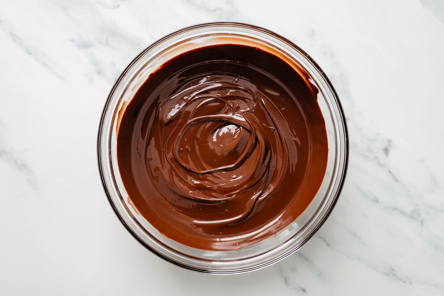 Bowl of melted chocolate for potato candy recipe
