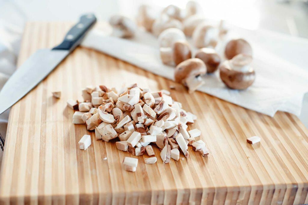chopped mushrooms on cutting board