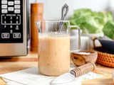 salad dressing in a jar next to microwave
