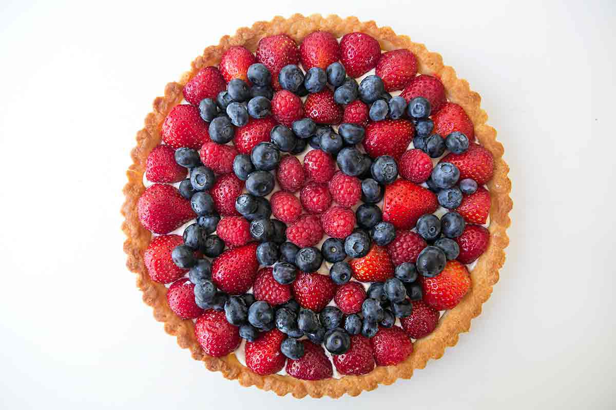 berry tart topped with fruit
