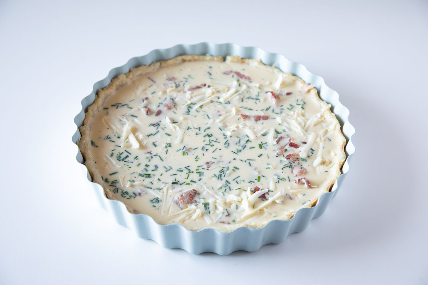 A basic quiche recipe ready for the oven.