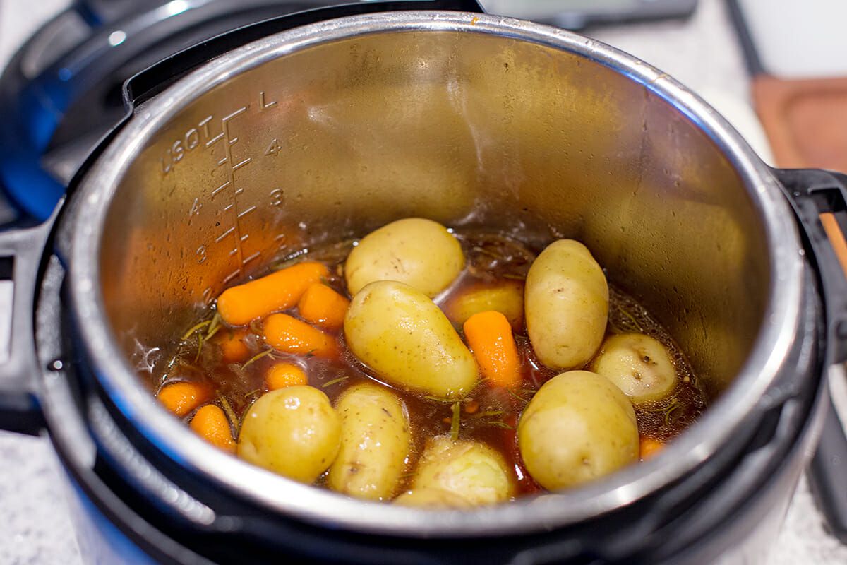 The cooked potatoes and carrots for the instant pot pot roast