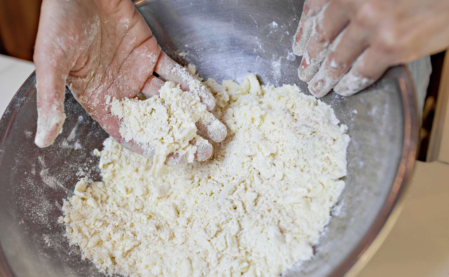 Desired Texture of Pie Dough Showcased for Manually Made Pie Dough Recipe