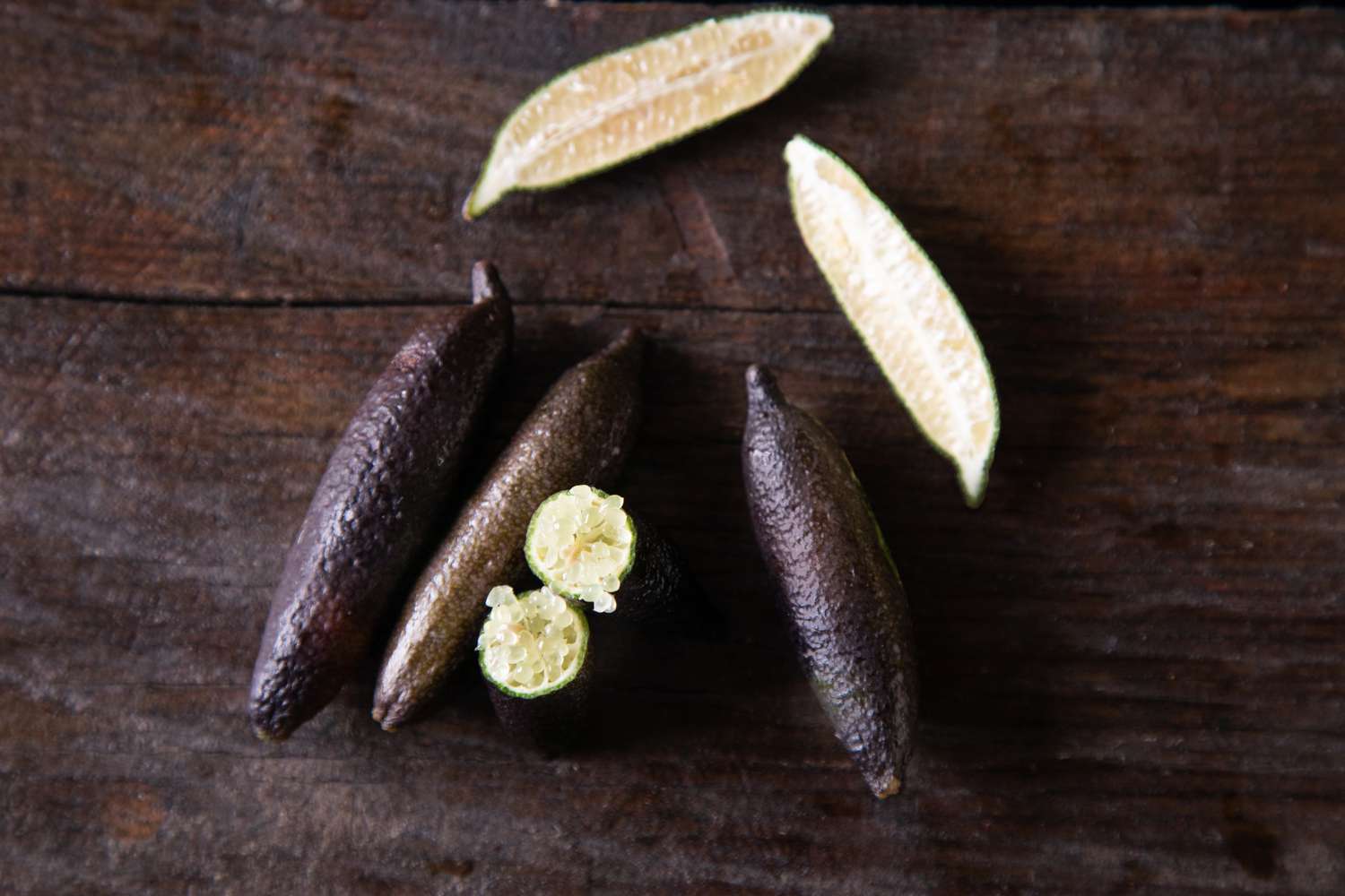 Finger limes on dark background