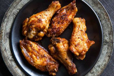 A plate of gilled BBQ chicken wings