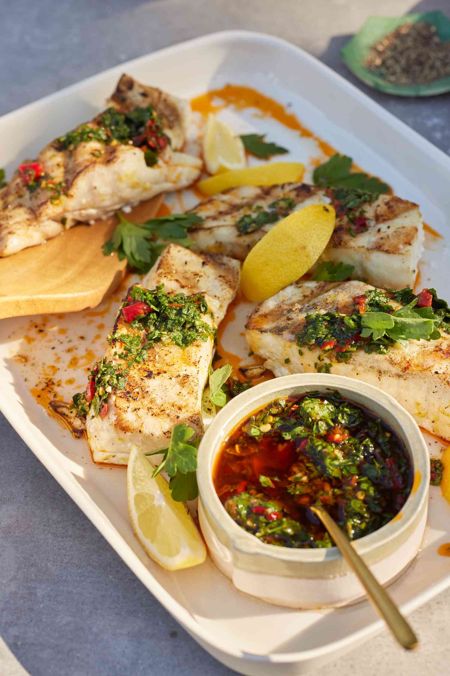 Plate of Grilled Halibut with Calabrian Chile Gremolata on a Table