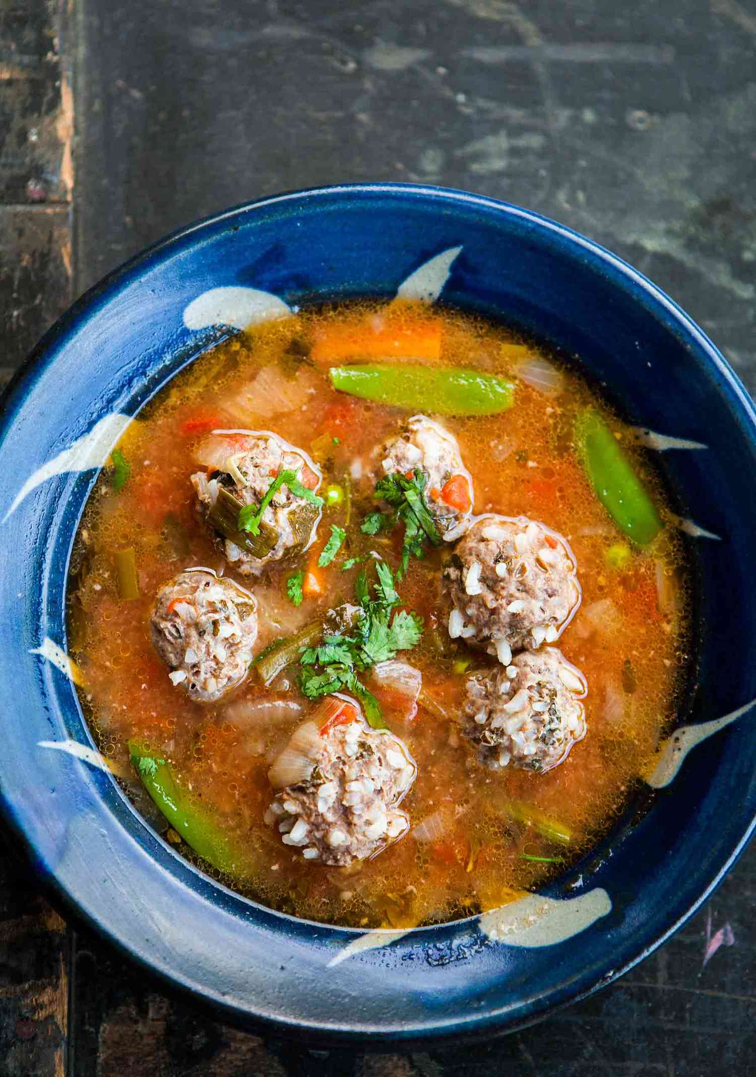 Albondigas Soup (Mexican Meatball Soup) in a blue bowl