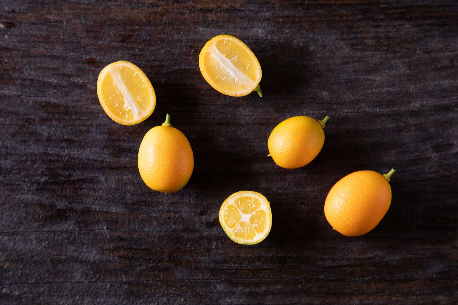 Kumquats on dark background