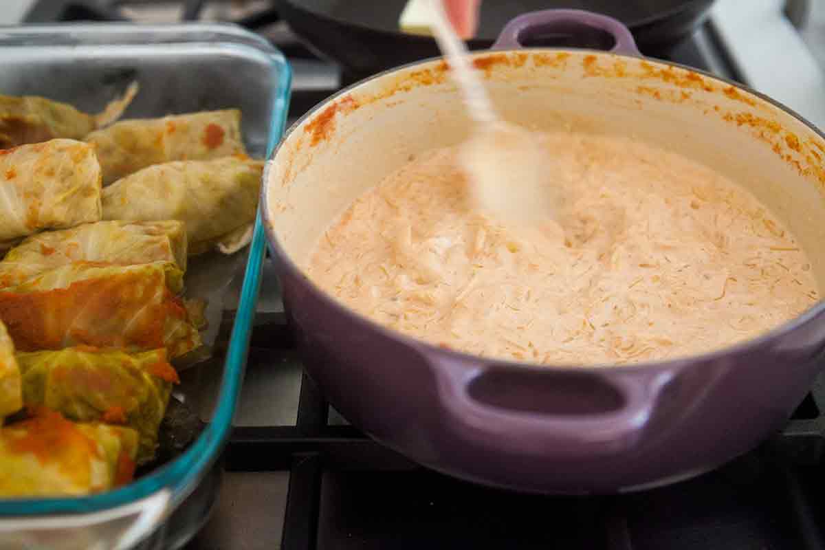 add sour cream to sauerkraut to make sauce for stuffed cabbage rolls