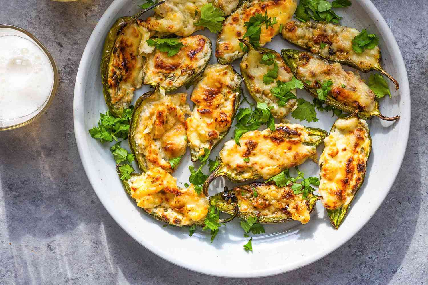 A plate of baked stuffed jalapenos