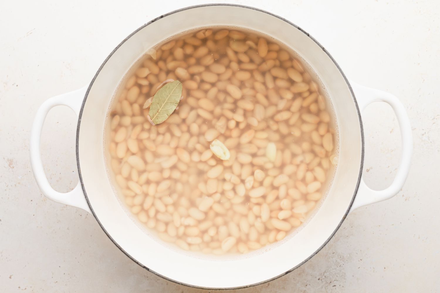 Dutch oven with beans to make a white chicken chili.