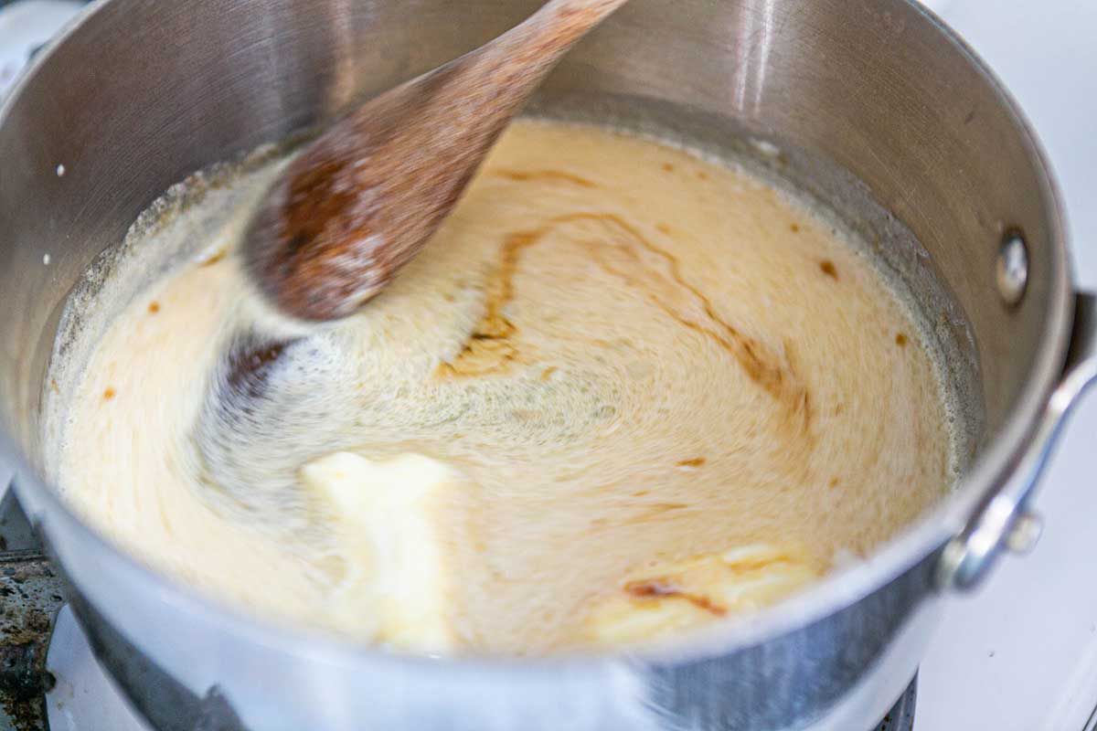 How to Make Caramel Apples bring the ingredients to a boil in a pot