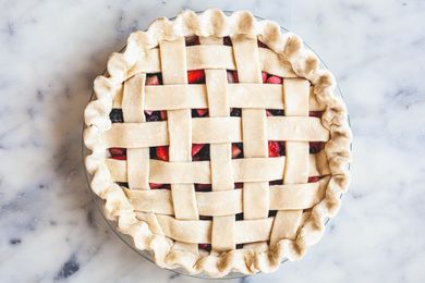 Showing how to crimp pie crust.