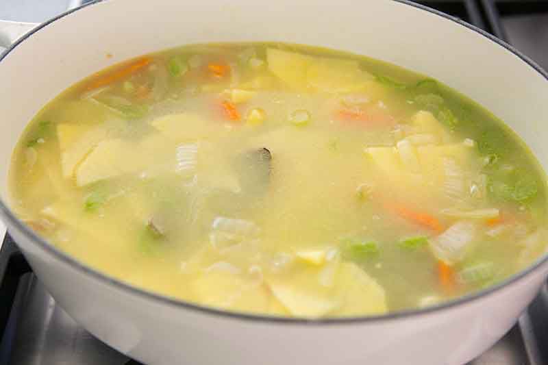 Pre mixed cauliflower cheddar soup ingredients in cooking pot