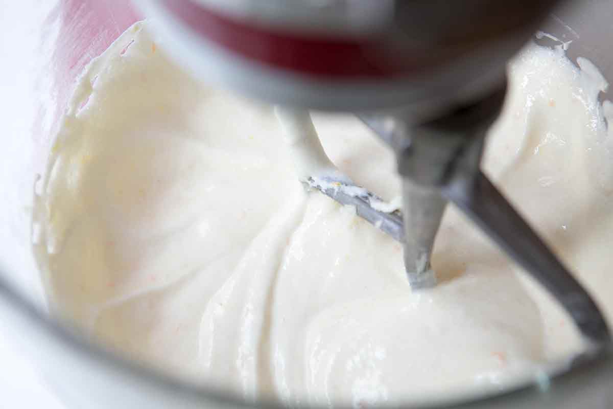 Add the sour cream/baking soda mixture to the egg mixture for the fruitcake recipe