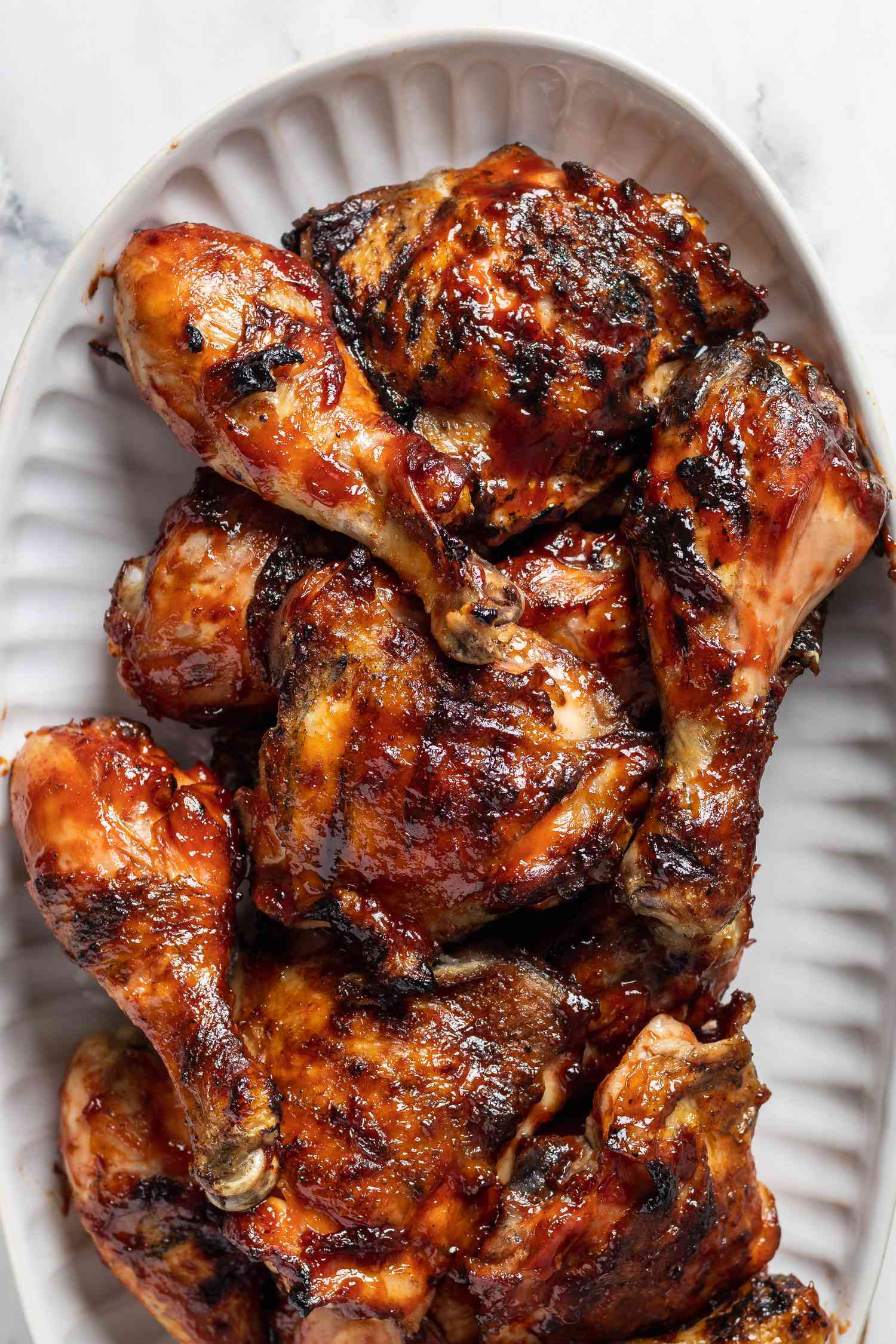 Overhead view of grilled chicken legs and thighs