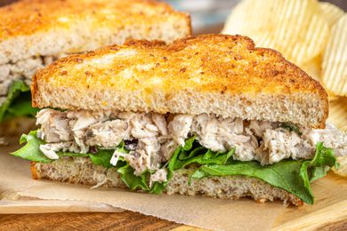 A photo of a tuna salad sandwich with lettuce