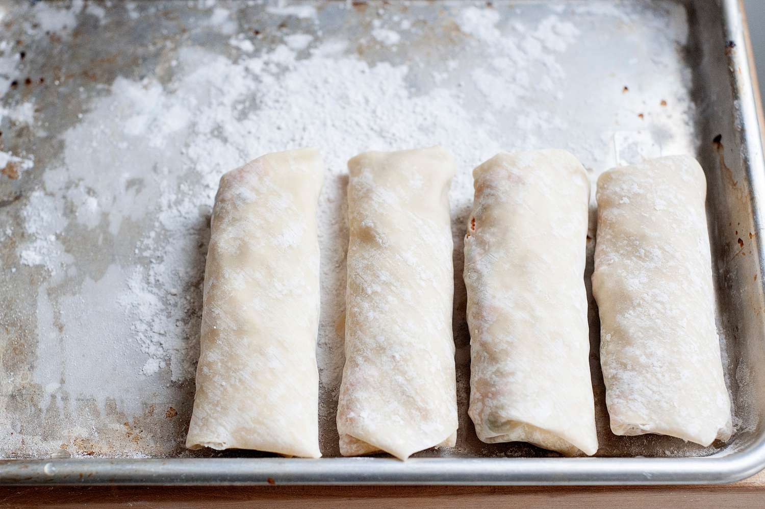 Vegetarian egg rolls frying.