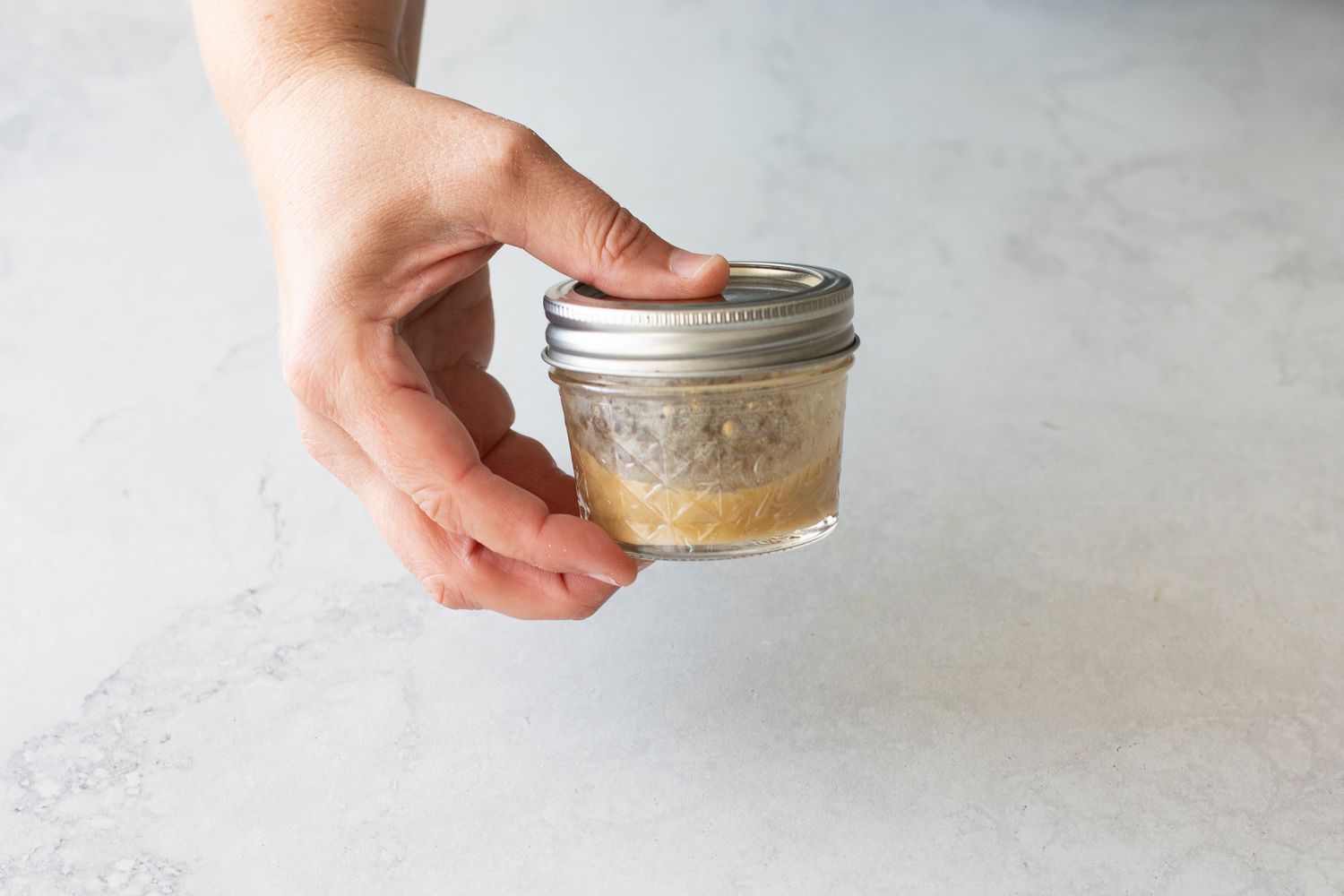 Jar of Red Wine Vinaigrette for Green Salad with Fresh Herbs 