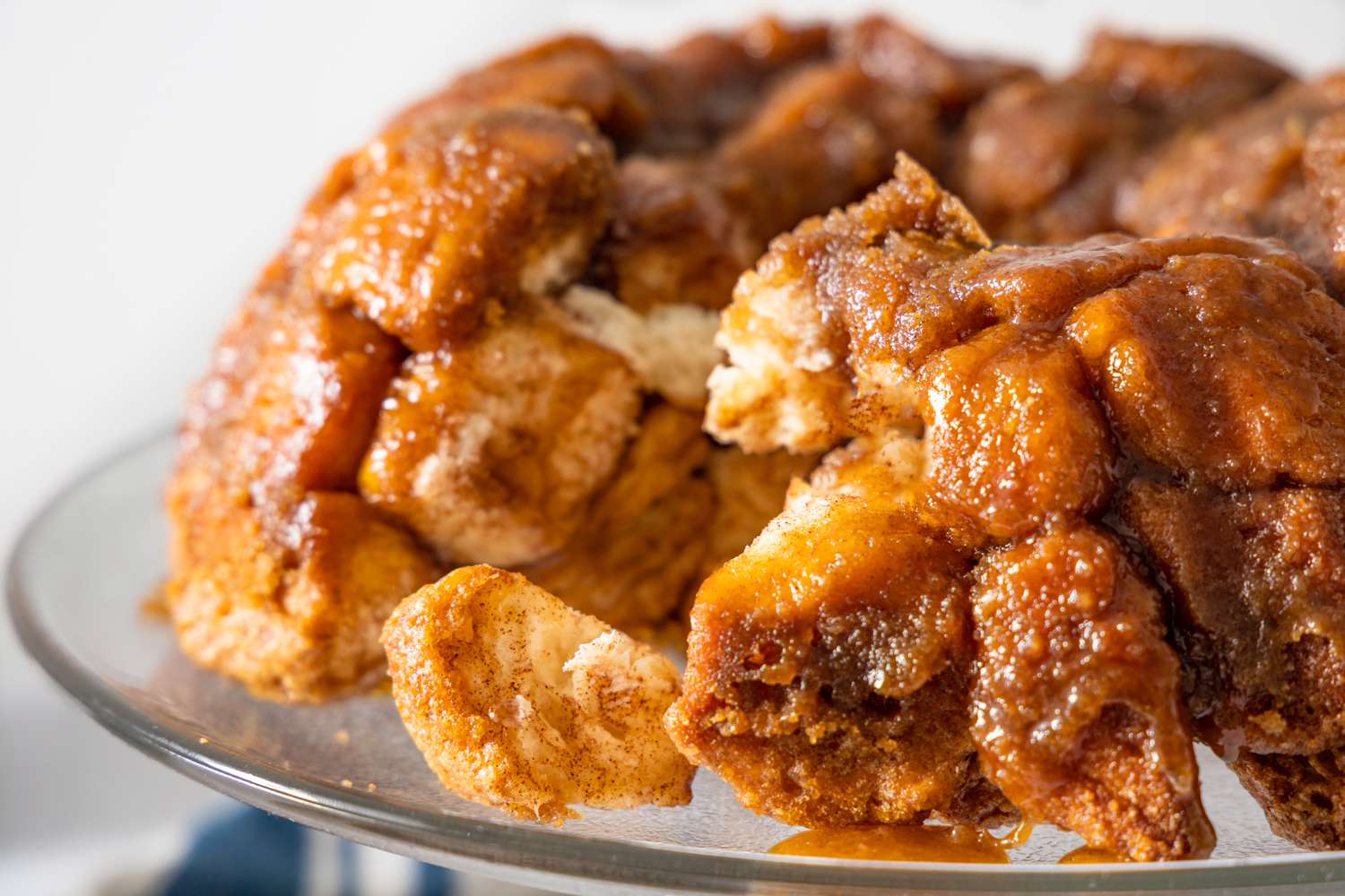 Monkey Bread on a Cake Stand with Pieces of Bread Broken Off 