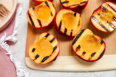 Grilled Peaches on a Wood Board