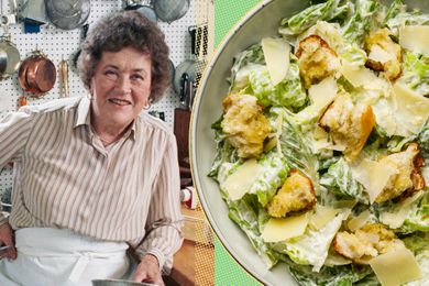 Julia Child next to a Caesar salad in a kitchen setting